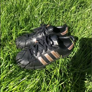 Black and gold adidas